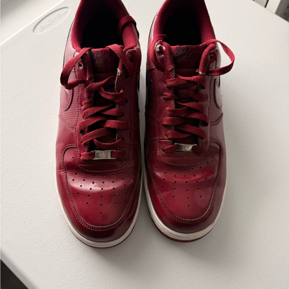 Nike Air Force 1 '07 'Team Red' sneakers in patent leather.